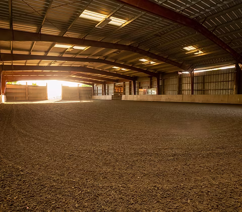 The lighted indoor riding arena
